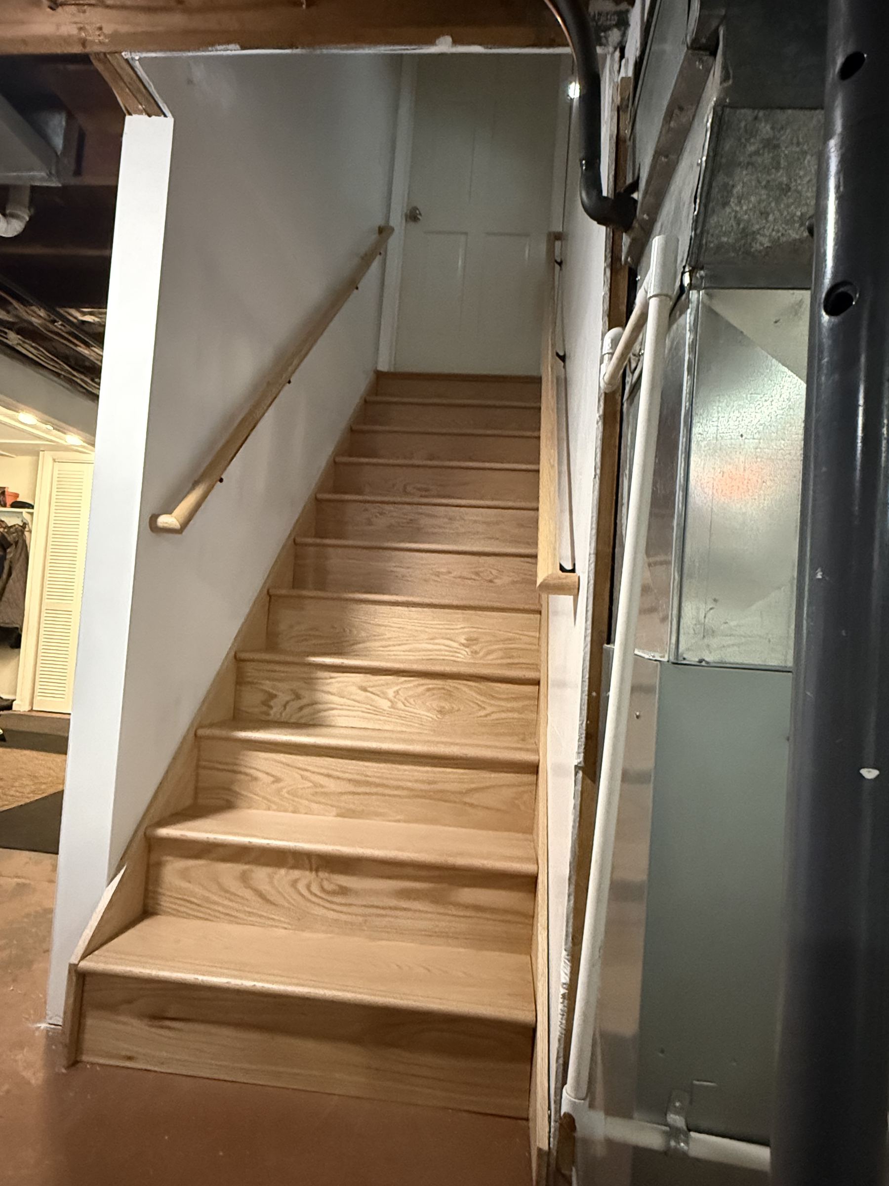 Basement staircase rough-in with new handrail