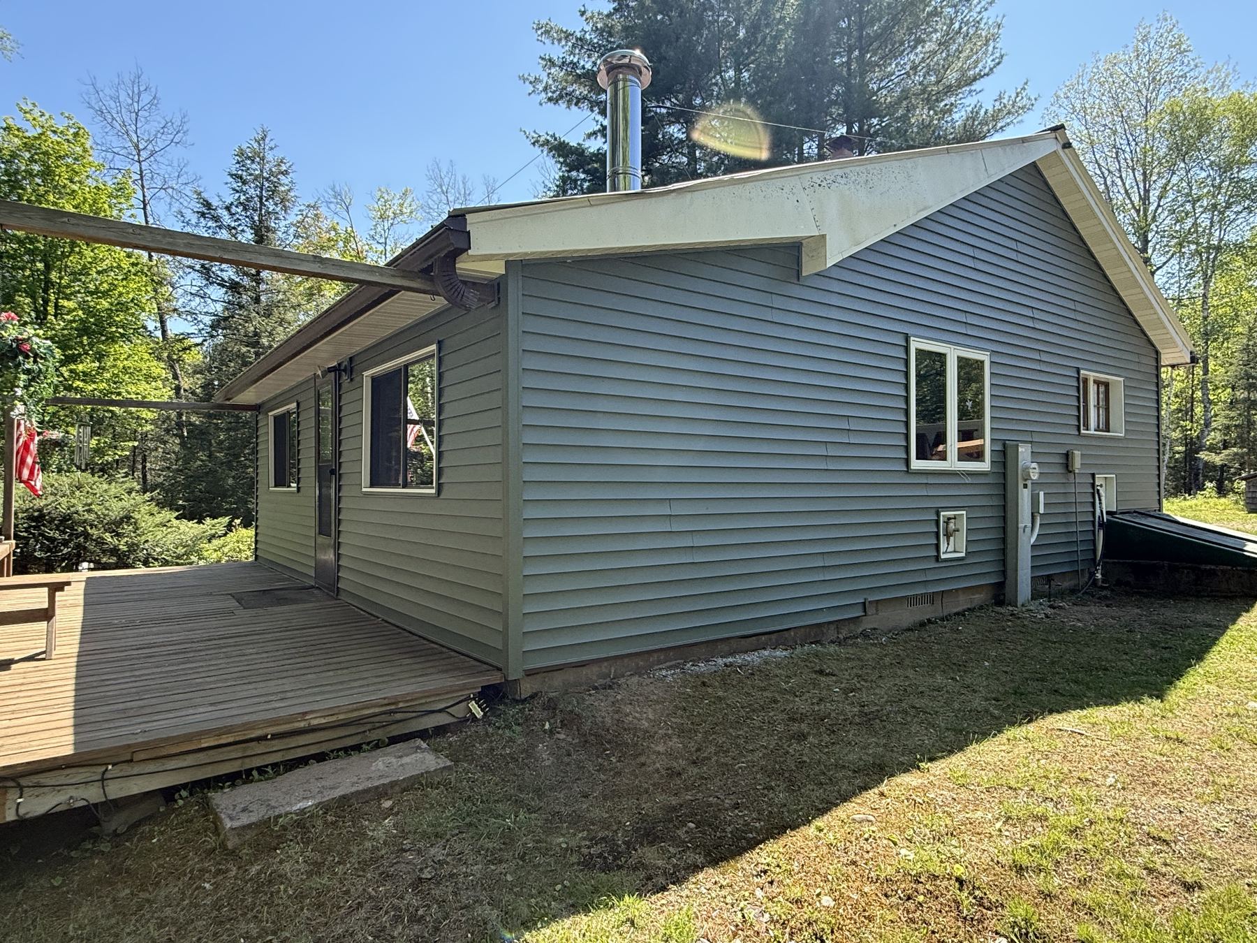 New home construction with green vinyl siding