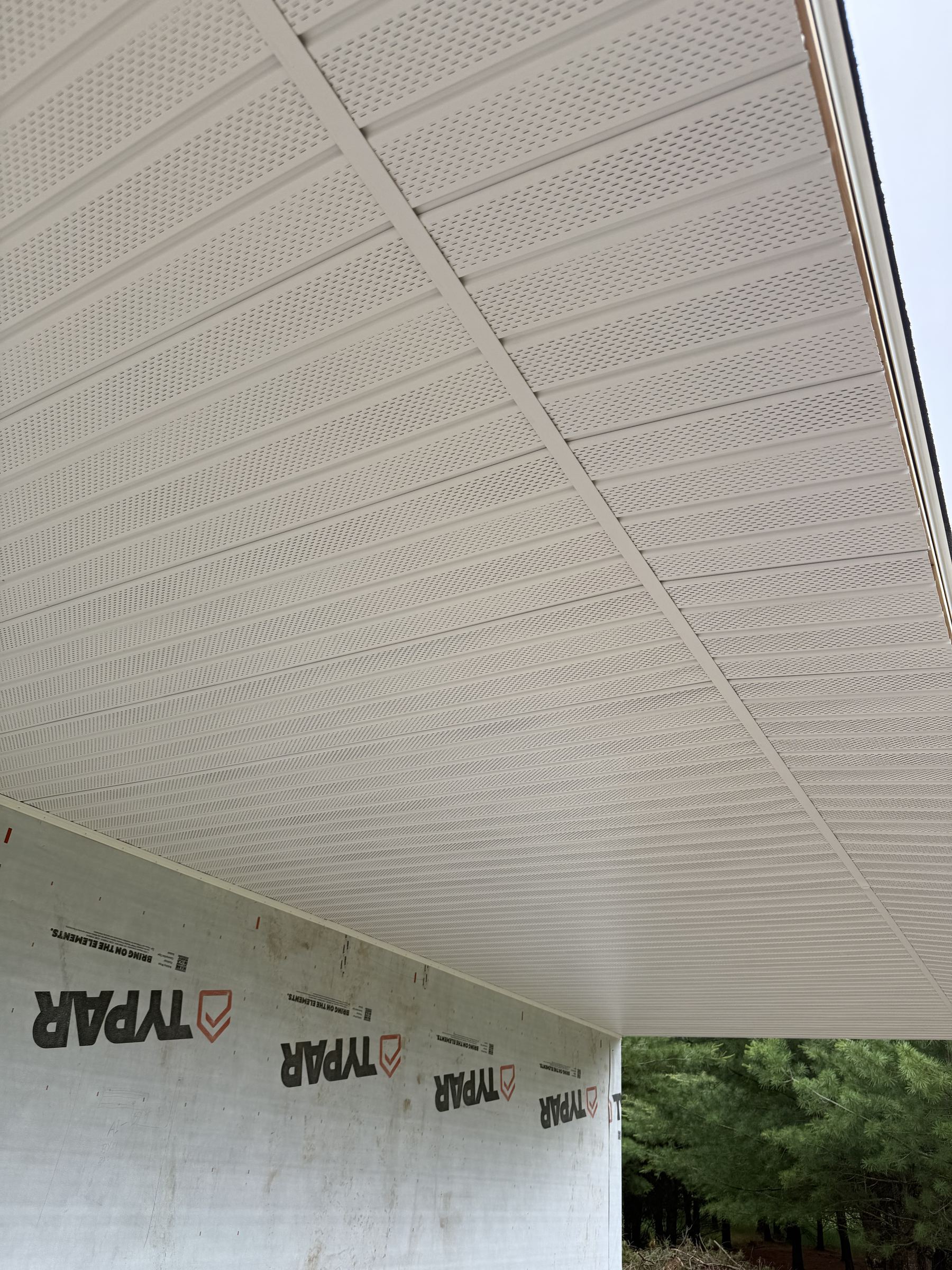 Soffit vent installation under eave